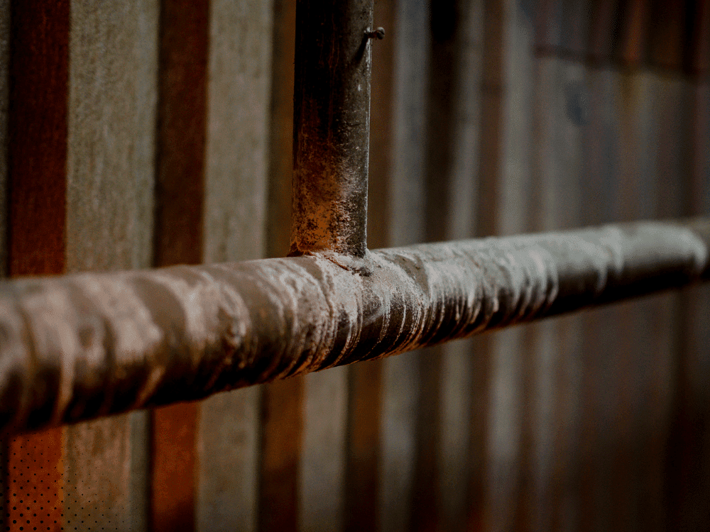 Corroded metal pipe in an older home inspected for plumbing concerns in Lafayette, LA and the Acadiana area