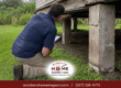 Professional home inspector checking pier-and-beam foundation in Lafayette, LA for structural integrity and safety